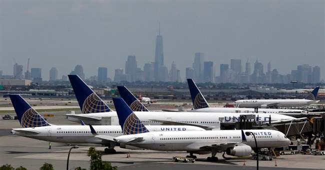 United Airlines jets are parked on the tarmac at Newark Liberty International Airport, Tuesday, July 22, 2014, in Newark, N.J. 