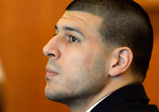 Former NFL football player Aaron Hernandez watches during a hearing in Bristol County Superior Court Tuesday, July 22, 2014, in Fall River, Mass. 