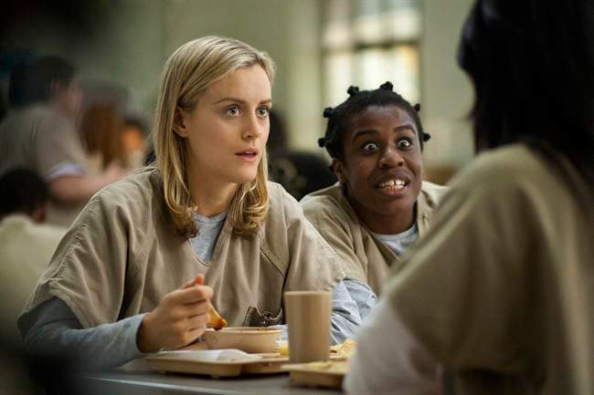Taylor Schilling, left, and Uzo Aduba in a scene from "Orange Is the New Black."