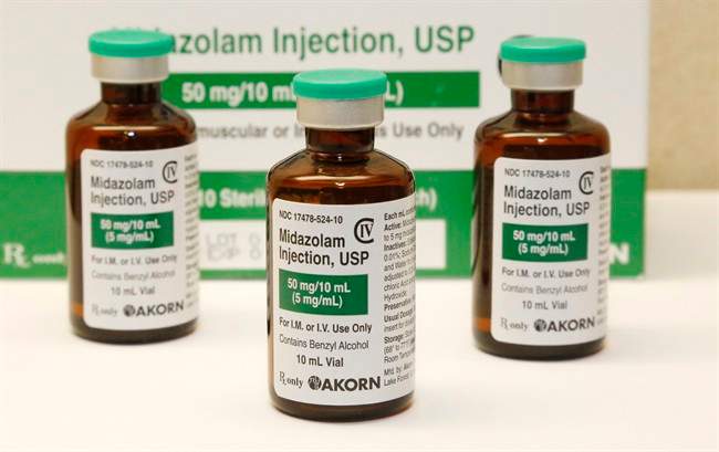 This Friday, July 25, 2014 photo shows bottles of the sedative midazolam at a hospital pharmacy in Oklahoma City. 