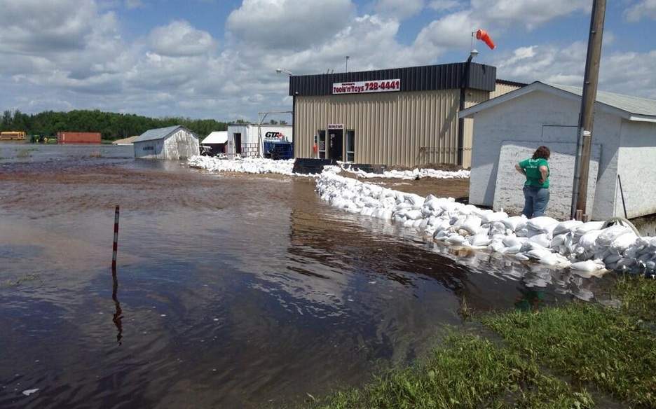 Hundreds of home and business owners in Melville continue cleanup efforts, as water levels begin to recede around the community.