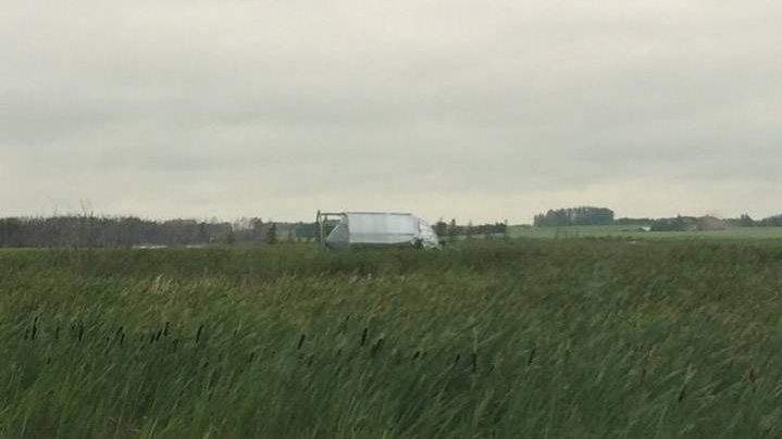 These are just south of Saskatoon (not far from the SIR racetrack) – the lonely grain bin is actually supposed to be on the other side of the highway with the other two grain bins (one of which is over too)