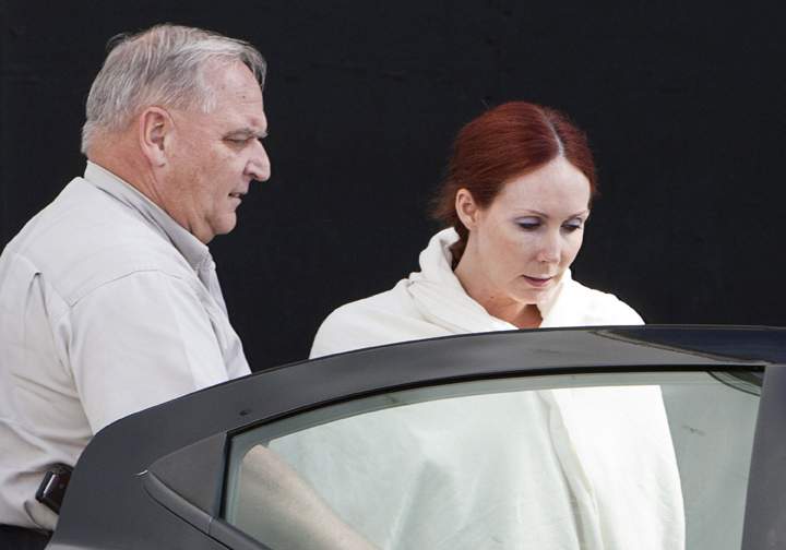 In this June, 7, 2013, file photo, Shannon Richardson is escorted to a Titus County Sheriff's car after a court appearance in Texarkana, Texas. 