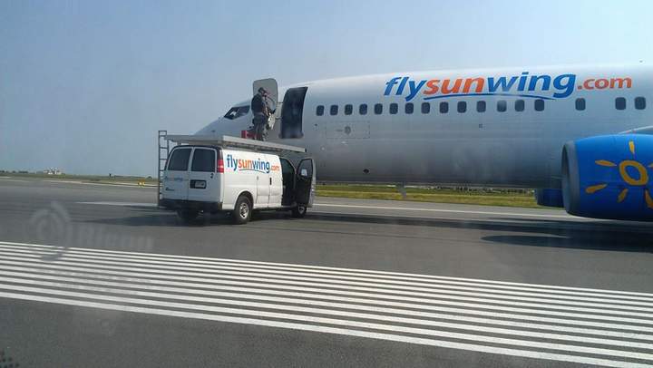 Alain Alphonso posted images of the tactical team and the Sunwing plane on his Facebook page.