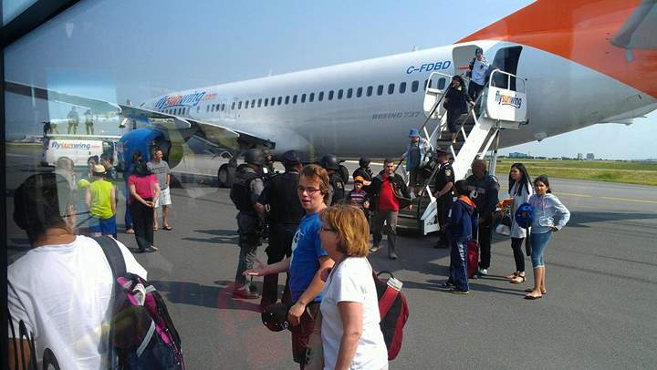 Alain Alphonso posted images of the tactical team and the Sunwing plane on his Facebook page.