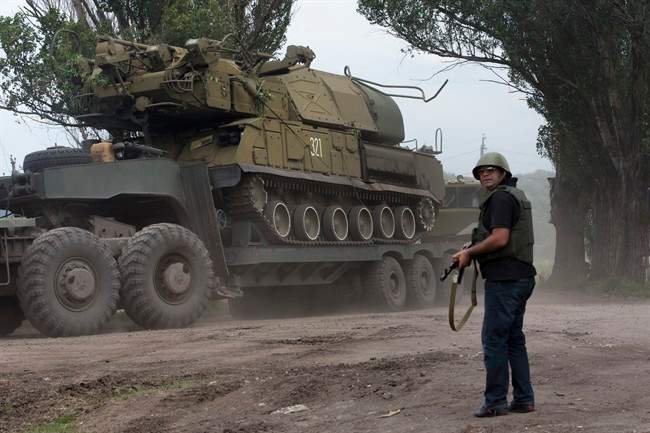 Ukrainian government forces manoeuvre antiaircraft missile launchers as they are transported north-west from Slavyansk, eastern Ukraine Friday, July 4, 2014. 
