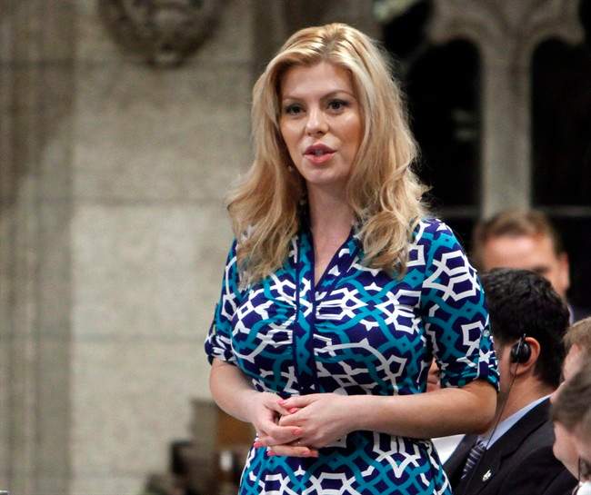 Eve Adams, Conservative MP and Parliamentary Secretary to the Minister of Health, stands in the House of Commons during question period Friday May 30, 2014. Adams, who has been in a heated nomination battle in the new Toronto-area riding of Oakville North-Burlington, says she is dropping out for health reasons.THE CANADIAN PRESS/Fred Chartrand.