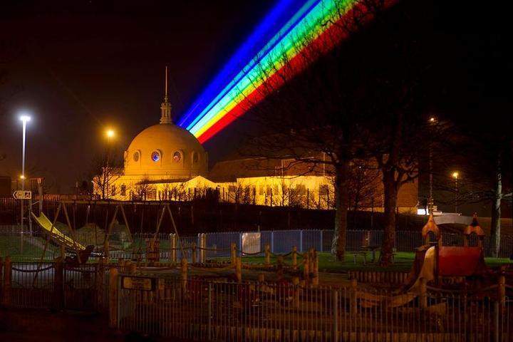 WHITLEY BAY, ENGLAND - MARCH 01: International artist Yvette Mattern shows her stunning laser rainbow projection, Global Rainbow, on March 1, 2012