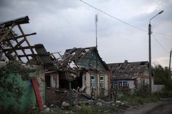 A picture shows houses destroyed by combat between the Ukrainian armed forces and pro-Russian militants, in the village of Senyonovka, near the eastern Ukrainian city of Slavyansk, on August 7, 2014. Fighting raged on in Ukraine's industrial east, where local authorities have warned of a looming humanitarian catastrophe. NATO chief Anders Fogh Rasmussen urged Russia to "step back from the brink" during a visit to Kiev on Thursday and vowed support for Ukraine as fears mounted that Moscow was preparing to send troops into the conflict-torn east of the country. 