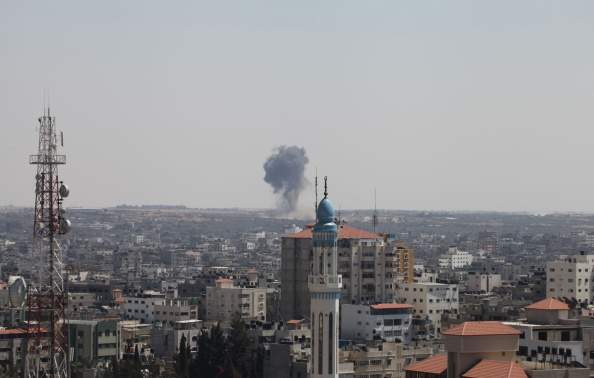 Smoke rises from Gaza City following an Israeli air strike on August 21, 2014. (Photo by Mohammad Othman/Anadolu Agency/Getty Images).