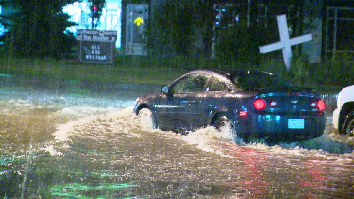 An intense storm floods Main Street in Airdrie around 11 p.m. on Thursday, August 8th, 2014.