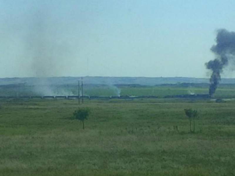 Emergency crews have been called to the scene of a train fire west of Moose Jaw.