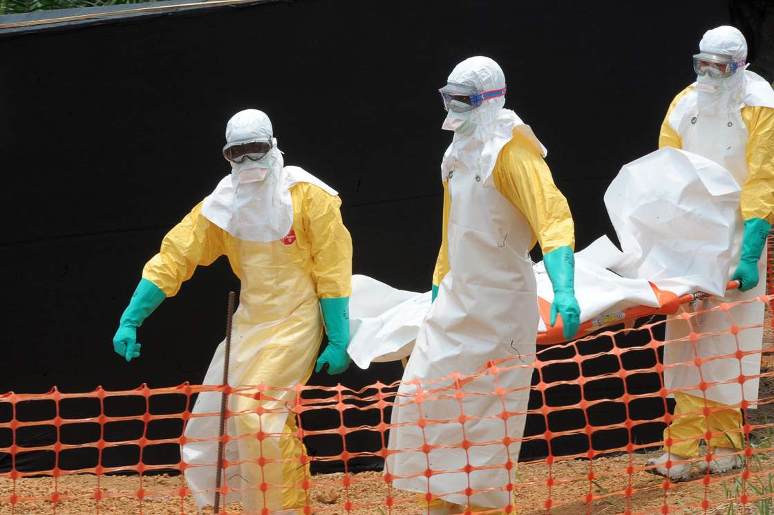 Staff of the 'Doctors without Borders' medical aid organisation carry the body of a person killed by viral haemorrhagic fever.