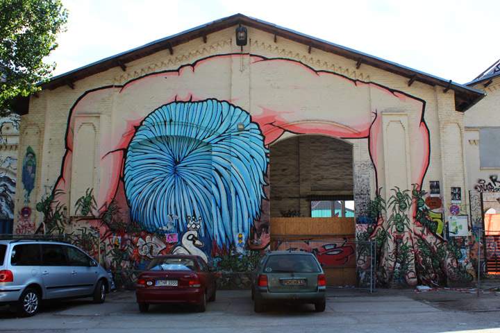 A mural runs across an entire building.