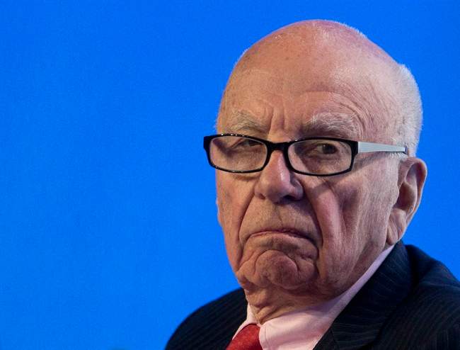 FILE - In this July 17, 2014 photo, Rupert Murdoch, executive chairman of News Corporation, listens to a question during a panel discussion at the B20 meeting of company CEOs in Sydney, Australia. Murdoch’s 21st Century Fox on Tuesday, Aug. 5, 2014 said it is abandoning its attempt to take over Time Warner in a proposed deal that would have combined two of the world’s biggest media companies.