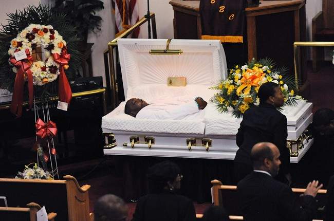 In this July 23, 2014 file photo, Eric Garner's body lies in a casket during his funeral at Bethel Baptist Church in the Brooklyn borough of New York.