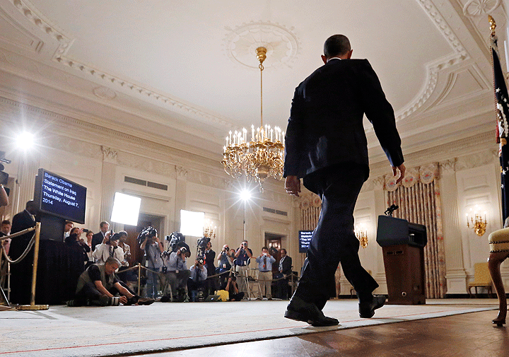 President Barack Obama approaches the podium to speak about the situation in Iraq in the State Dining Room at the White House in Washington, Thursday, Aug. 7, 2014.