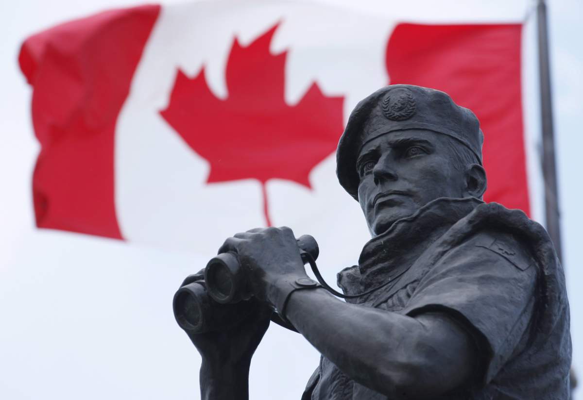 The Canadian Flag flies over the Peacekeeping memorial in Ottawa Tuesday May 29, 2012.
