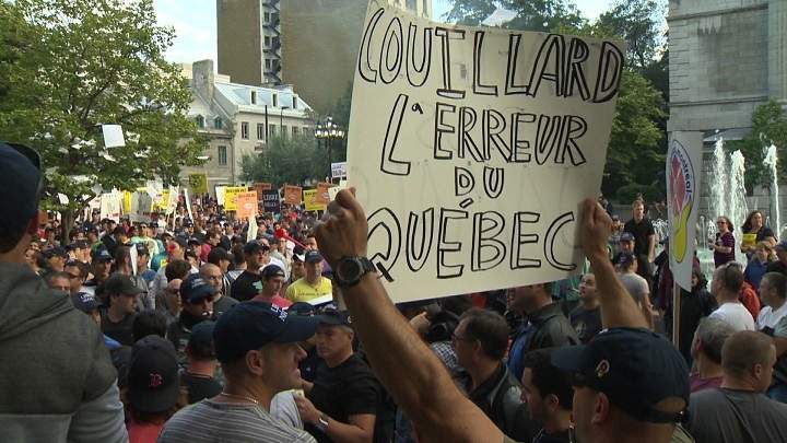 Protesters against Bill 3 storm city hall on August 18, 2014.