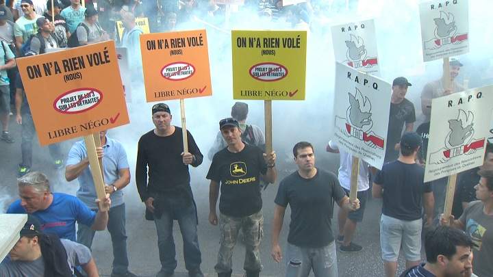 Protesters against Bill 3 storm city hall on August 18, 2014.