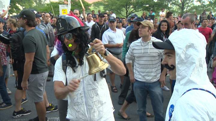 Protesters against Bill 3 storm city hall on August 18, 2014.