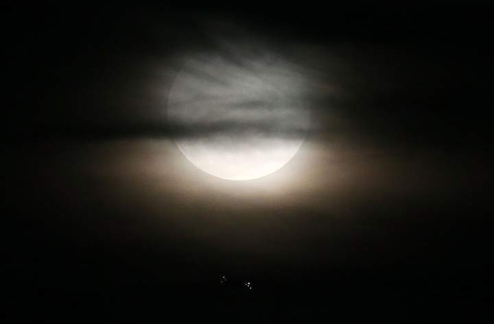 A supermoon rises in the sky on August 10, 2014 in Rio de Janeiro, Brazil.