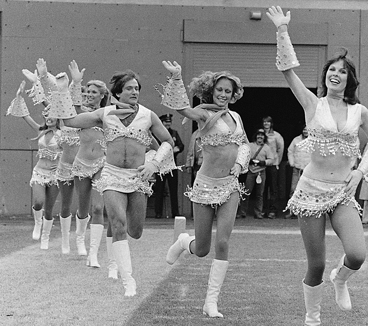FILE – This Nov. 12, 1979 file photo shows actor-comedian Robin Williams, third from right, dressed as a cheerleader with the Broncos’ Pony Express cheerleaders during the filming of an episode of “Mork & Mindy,” in Denver.