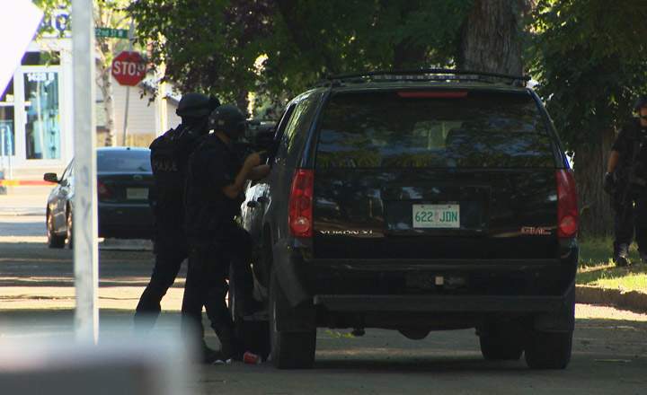 Saskatoon police dealing with a standoff in the 100-block of Avenue O South on Tuesday Aug. 12, 2014.