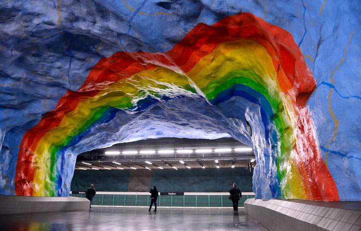 People walk at the Stadion metro station on November 6, 2012 in Stockholm, Sweden, decorated in 1973 by artists Enno Hallek and Ake Pallarp.