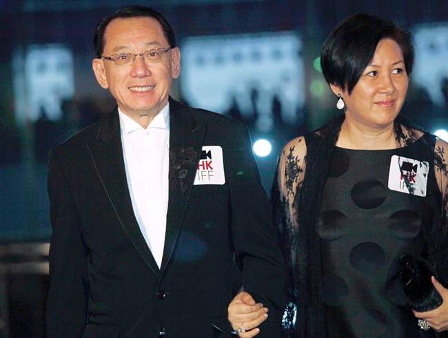 Albert Yeung, left, chairman of the Hong Kong media conglomerate Emperor Entertainment Group and his wife attend the premiere of his film " Shinjuku Incident.".