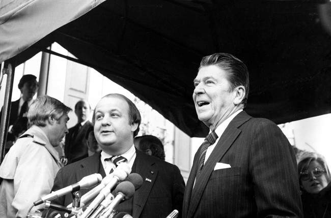 This Jan. 6, 1981 file photo shows President-elect Ronald Reagan introducing James Brady as his press secretary in Washington. (AP Photo/Walt Zebowski, File) .