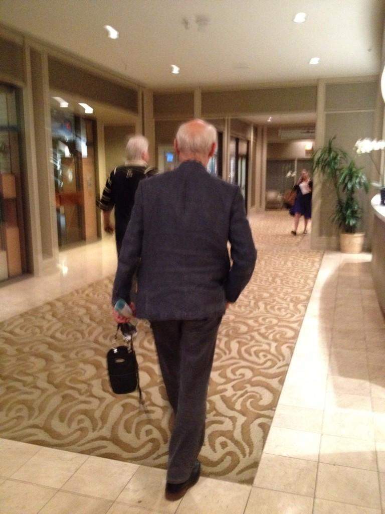 Peter Cameron leaving from a meeting with Vince Ready and Jim Iker back to the government negotiation room.