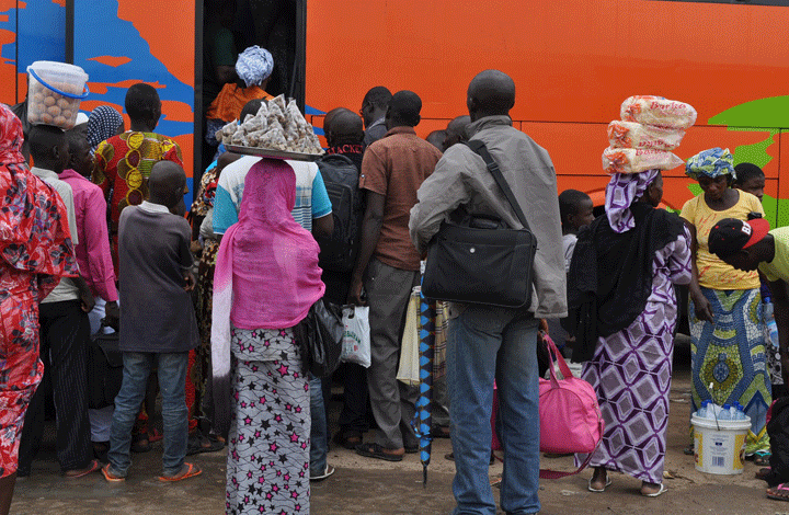People board a commercial bus to flee following attacks by Boko Haram in Bama and other parts of Maiduguri, Nigeria, Monday Sept. 8, 2014. Nigeria's Islamic extremist group, Boko Haram, has seized more towns along Nigeria's northeastern border with Cameroon and is adopting a strategy of encouraging civilians to stay, witnesses said Sunday, as the militants pursue their new aim to carve out an "Islamic caliphate" under their black and white flag.