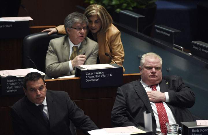 From left are Councillor Giorgio Mammoliti, Cesar Palacio, Councillor Frances Nunziata and Toronto Mayor Rob Ford, during a council meeting on April 1 2014 for debate on a proposal that would expand Billy Bishop City Centre Airport.