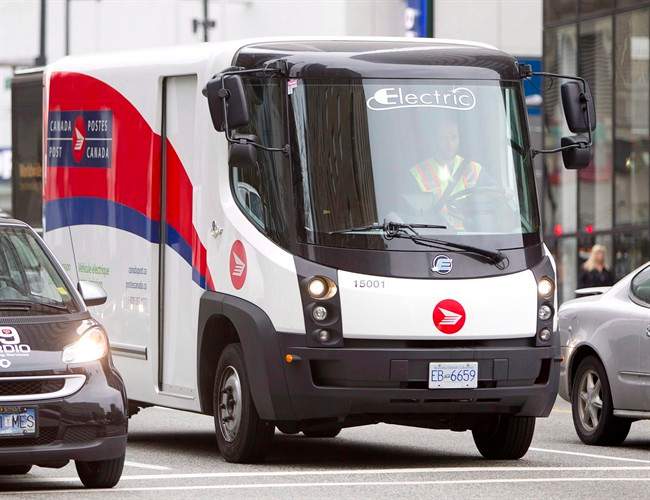 A Canada Post truck makes deliveries in Vancouver on September 21, 2012.