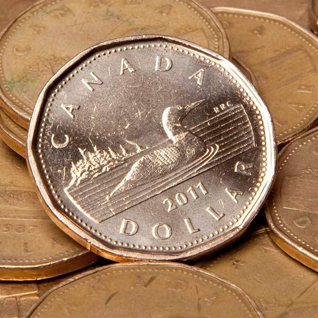 Canadian dollars (loonies) are pictured in Vancouver, Sept. 22, 2011. T.