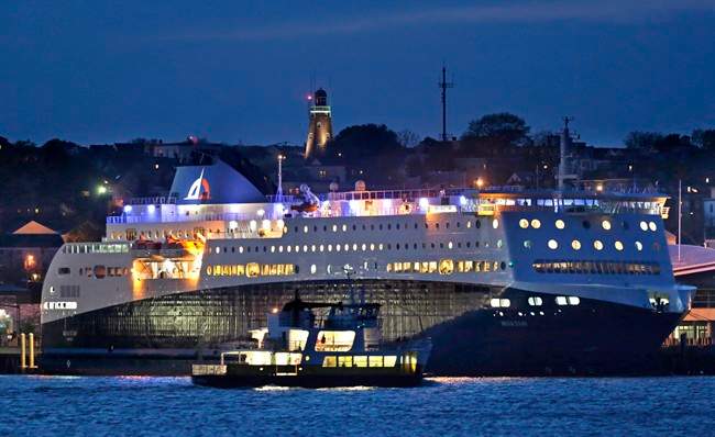 A smaller ferry passes by the Nova Star ferry (rear) as the ship prepares to make its maiden voyage from Portland, Maine to Yarmouth, N.S. on May 15, 2014.