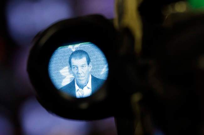 Baltimore Ravens owner Steve Bisciotti is seen through a television camera's viewfinder as he addresses the controversy surrounding former running back Ray Rice at an NFL football news conference, Monday, Sept. 22, 2014, in Owings Mills, Md.