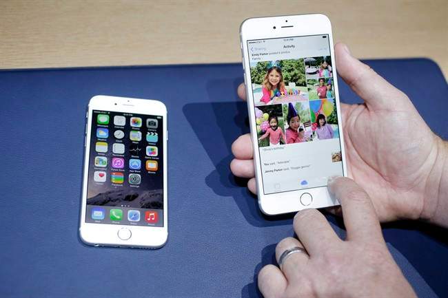 n this Sept. 9, 2014, file photo, the iPhone 6, at left, and iPhone 6 plus are shown next to each other during a new product release in Cupertino, Calif. 