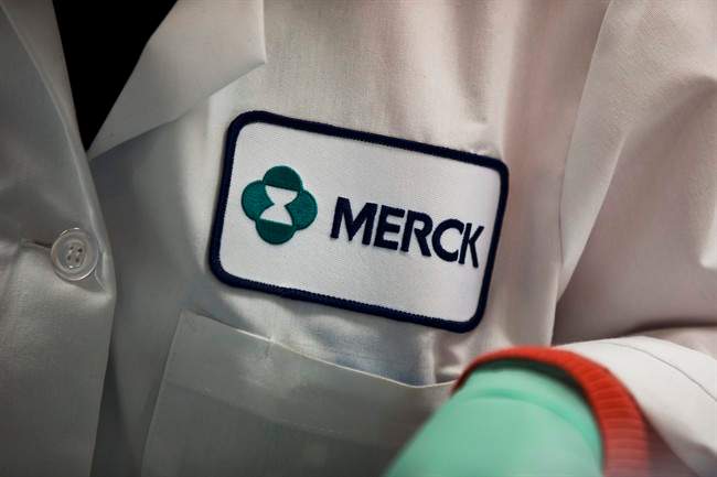 FILE - In this Thursday, Feb. 28, 2013 file photo, a Merck logo is placed on scientist's lab coat in West Point, Pa.