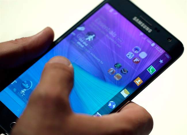 A visitor tabs on the display of a Samsung Galaxy Note edge during an 'Unpacked event' at the IFA, one of the world's largest trade fairs for consumer electronics and electrical home appliances in Berlin, Germany.