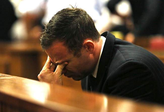Oscar Pistroius puts his hand to his face in court in Pretoria, South Africa, Friday, Sept. 12, 2014. 