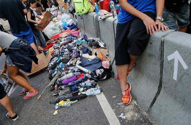Stacks of umbrellas are ready for pro-democracy protesters’ use to shield themselves from pepper spray Monday, Sept. 29, 2014 in Hong Kong.