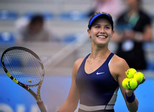 Eugenie Bouchard of Canada smiles after winning the women’s quarterfinal match against Alize Cornet of France at the WTA Wuhan Open tennis tournament in Wuhan, China’s Hubei Province, Thursday, Sept. 25, 2014.