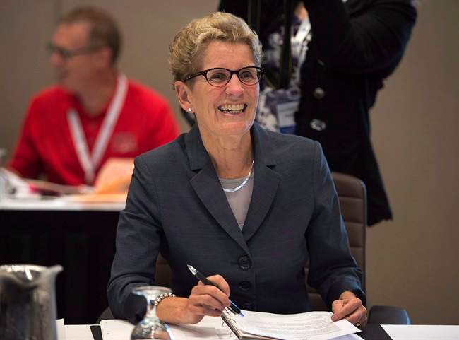 Ontario Premier Kathleen Wynne smiles at the start of a session at the annual Council of the Federation meeting in Charlottetown on Friday, August 29, 2014. 