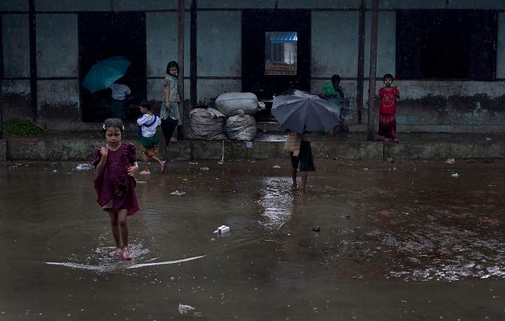 In this June 26 2014 photo, Rohingya children walk to school at The Chaung village school, north of Sittwe, Rakhine State, Myanmar.