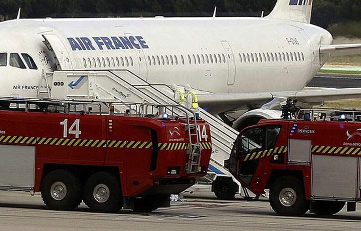 Spanish authorities isolated an Air France plane at Madrid's airport and activated emergency health procedures after one of the passengers was reported to have a fever and shivers in what is being treated as a suspected Ebola case, officials said Thursday.