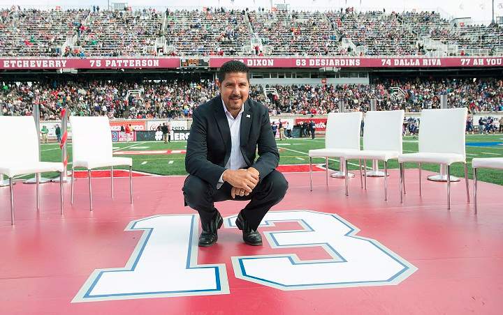 Former Montreal Alouettes quarterback Anthony Calvillo poses for a photo in Montreal, Monday, October 13, 2014, following a halftime ceremony to retire his jersey at a CFL game between the Alouettes and the Saskatchewan Roughriders.