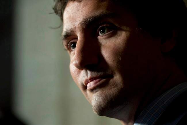 Liberal Leader Justin Trudeau speaks with the media following party caucus in Ottawa on October 8, 2014.