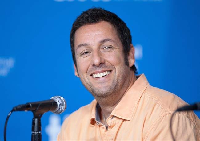 Actor Adam Sandler smiles during a press conference at the Toronto International Film Festival in this Sept. 6, 2014 file photo.